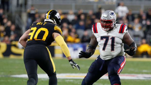Dec 7, 2023; Pittsburgh, Pennsylvania, USA; New England Patriots guard Mike Onwenu (71) blocks against Pittsburgh Steelers linebacker T.J. Watt (90) during the second quarter at Acrisure Stadium.
